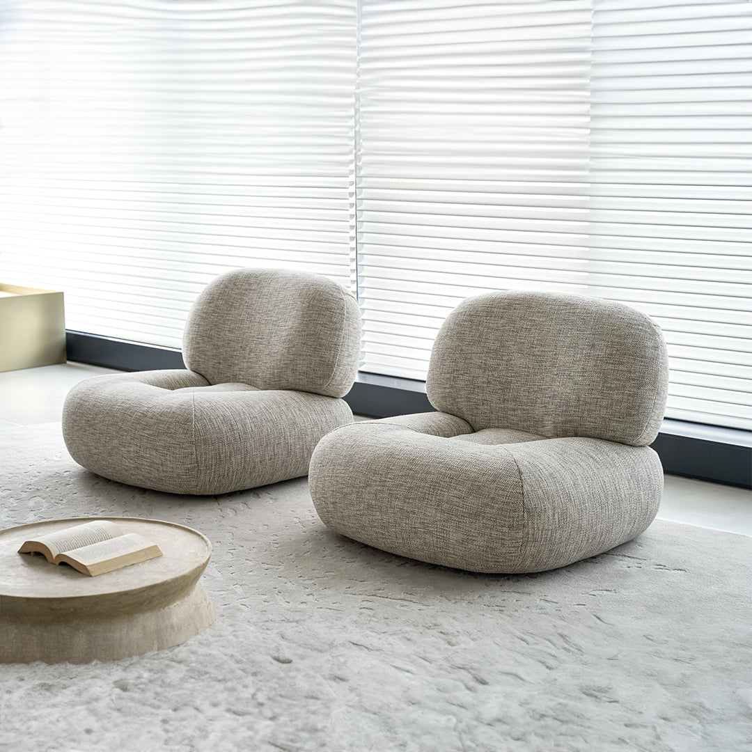BEACON Monarch Armchair AMCJ-DY6019 with plush fabric and wooden legs, showcasing a modern design in a cozy living room setting.