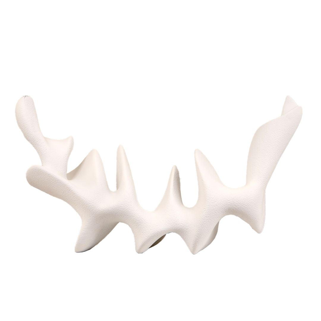 Moon-shaped desktop sculpture from BEACON home decor figurines collection, featuring a sleek, modern moon design.