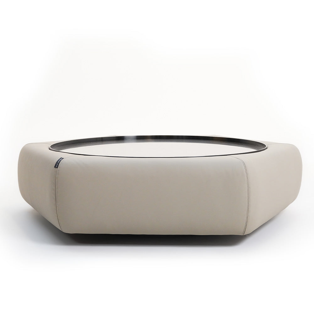 Beige mosaic octagon leather coffee table with black metal legs from BEACON, modern design, close-up view.