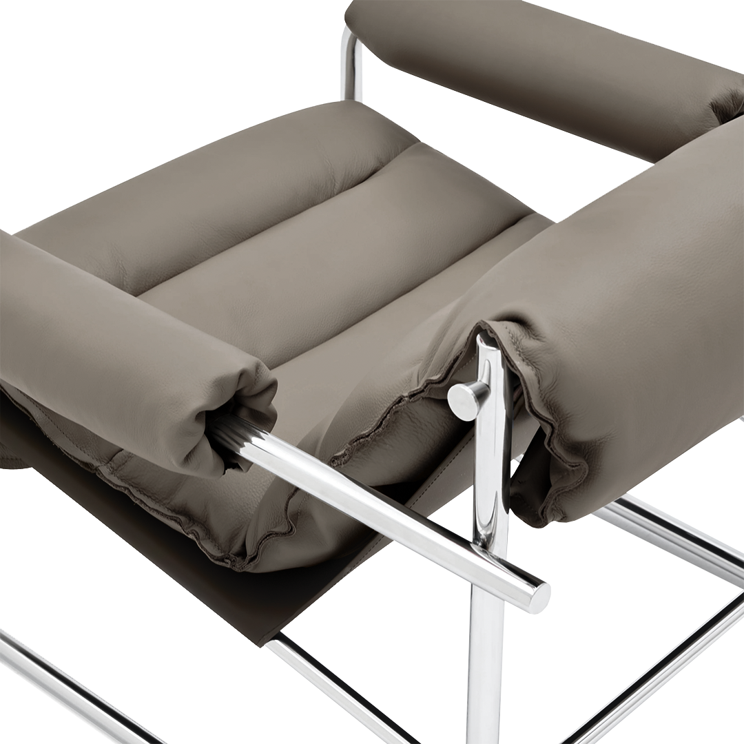 Beige Murcia leather lounge chair by BEACON, showcasing its plush cushioned seat and stylish armrests in a modern living space.