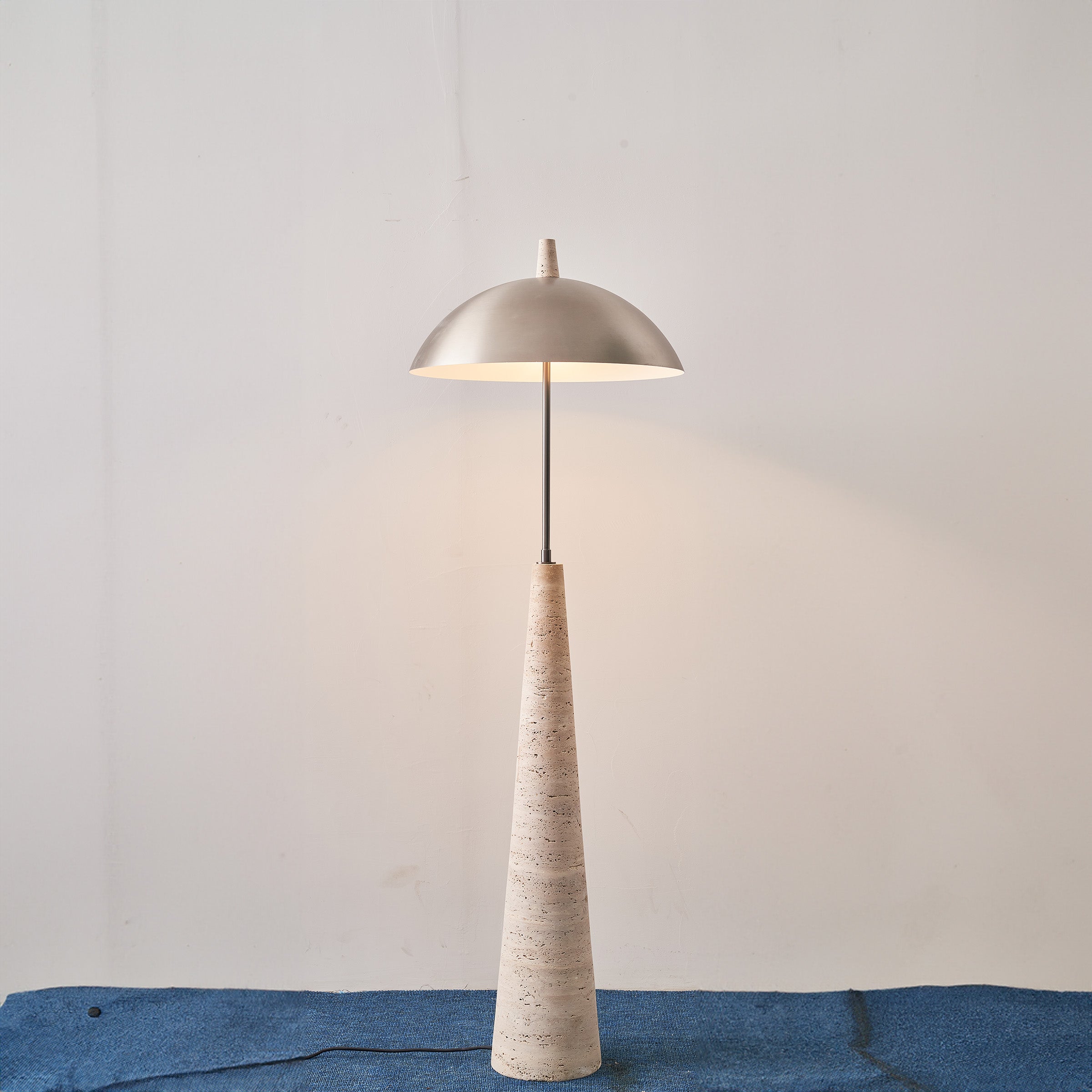 Natural travertine floor lamp by BEACON JIADG, model JA-015F, showcasing a stylish and elegant design in a well-lit setting.