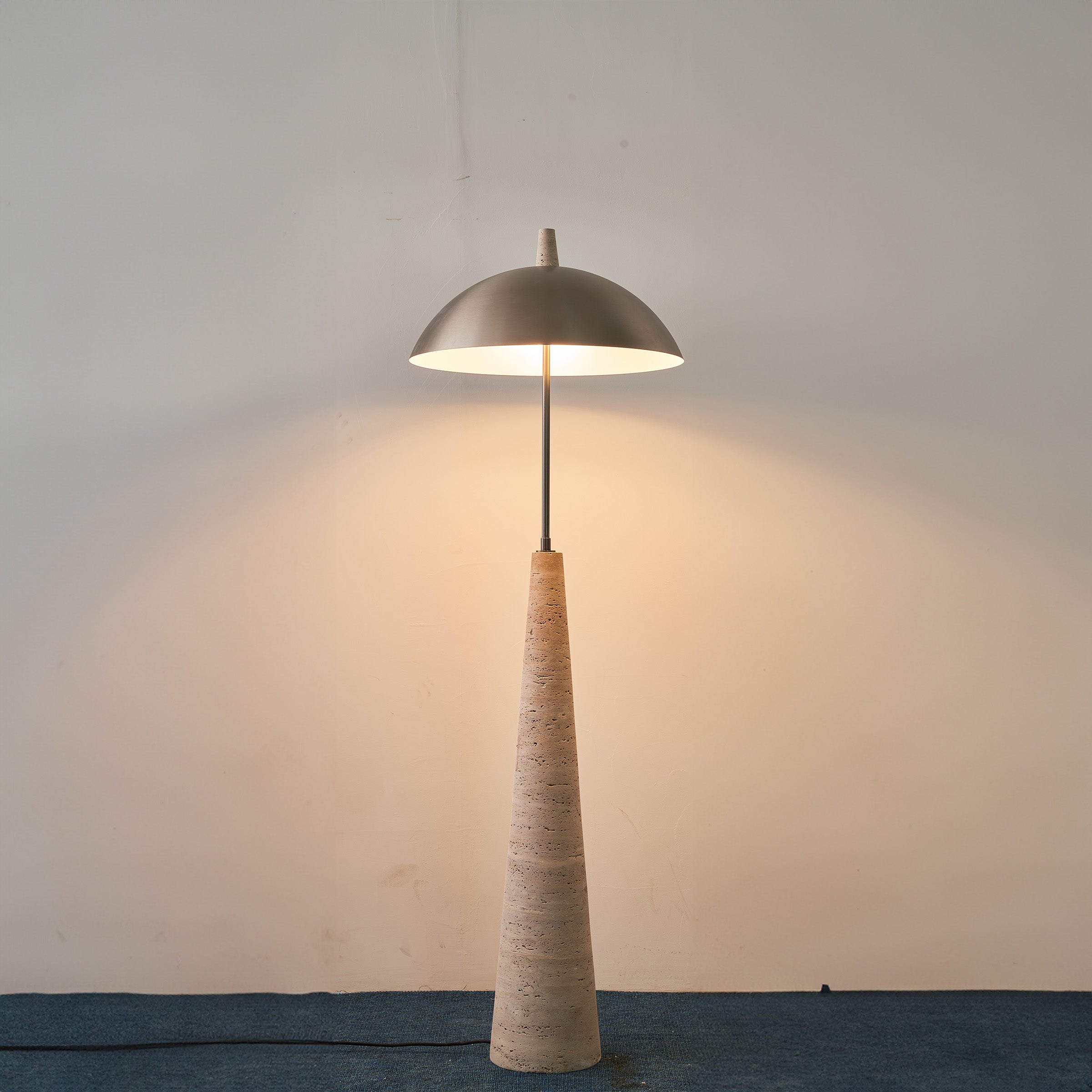 Natural travertine floor lamp by BEACON, model JA-015F, featuring a sleek, modern design with a textured stone finish.