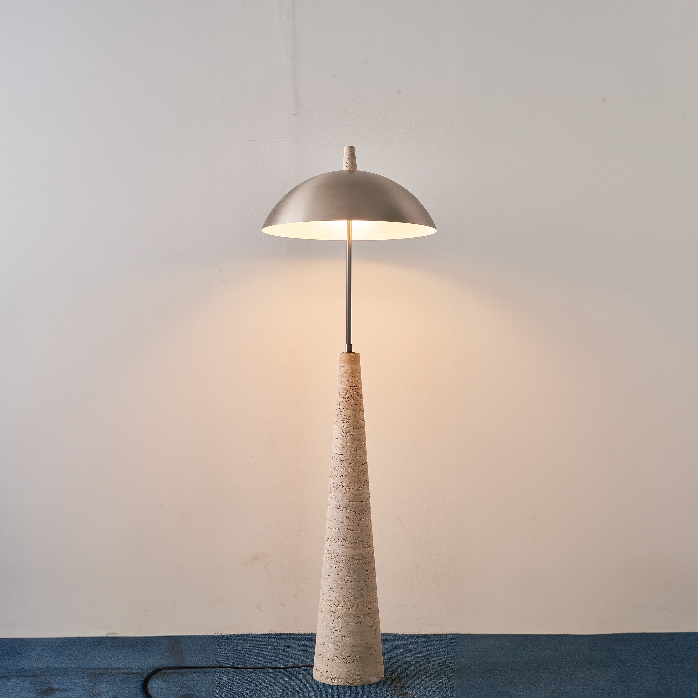 Natural travertine floor lamp by BEACON, model JA-015F, featuring a sleek, textured stone base and modern design for living spaces.