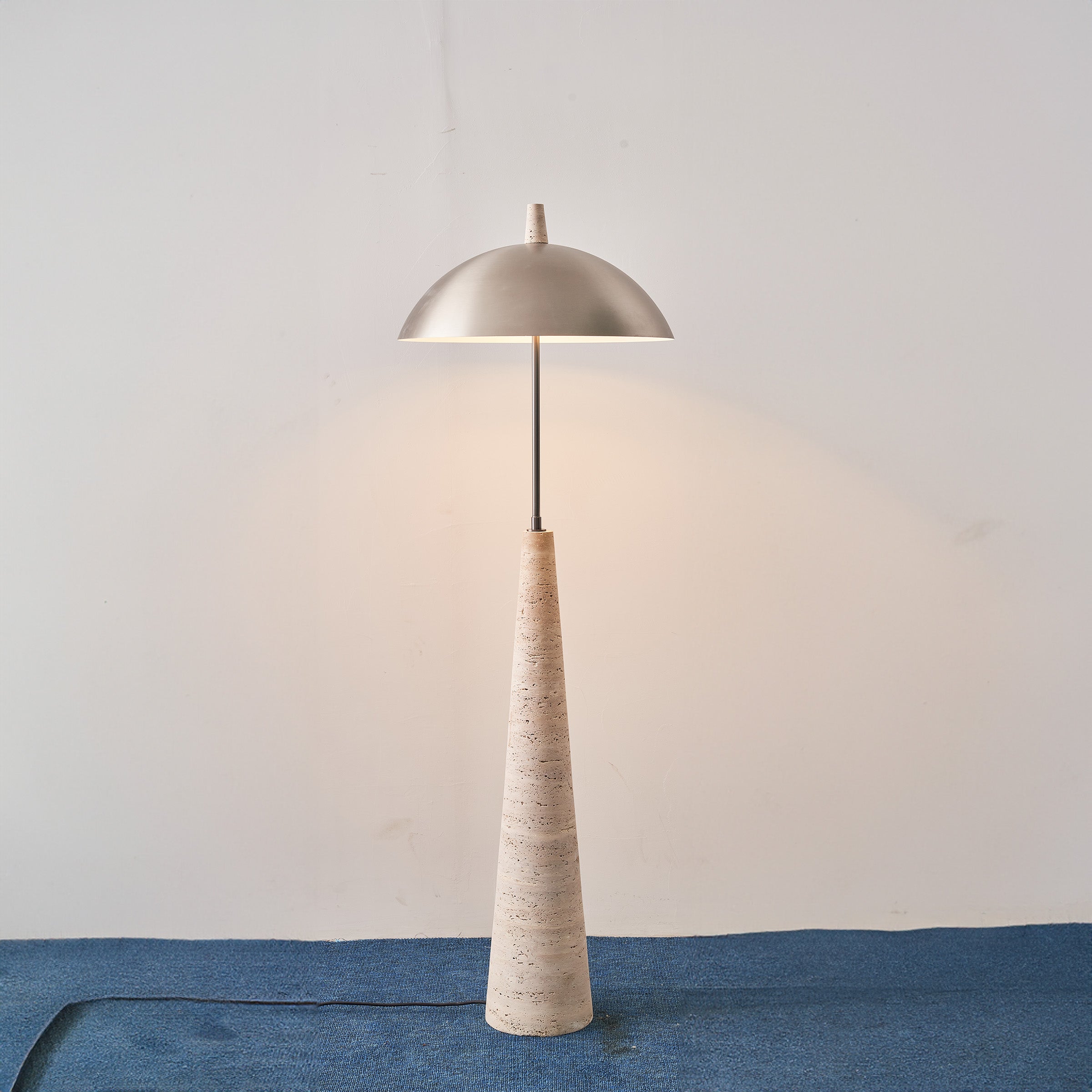 Natural travertine floor lamp by BEACON JIADG, modern design with textured stone finish, ideal for contemporary living spaces.