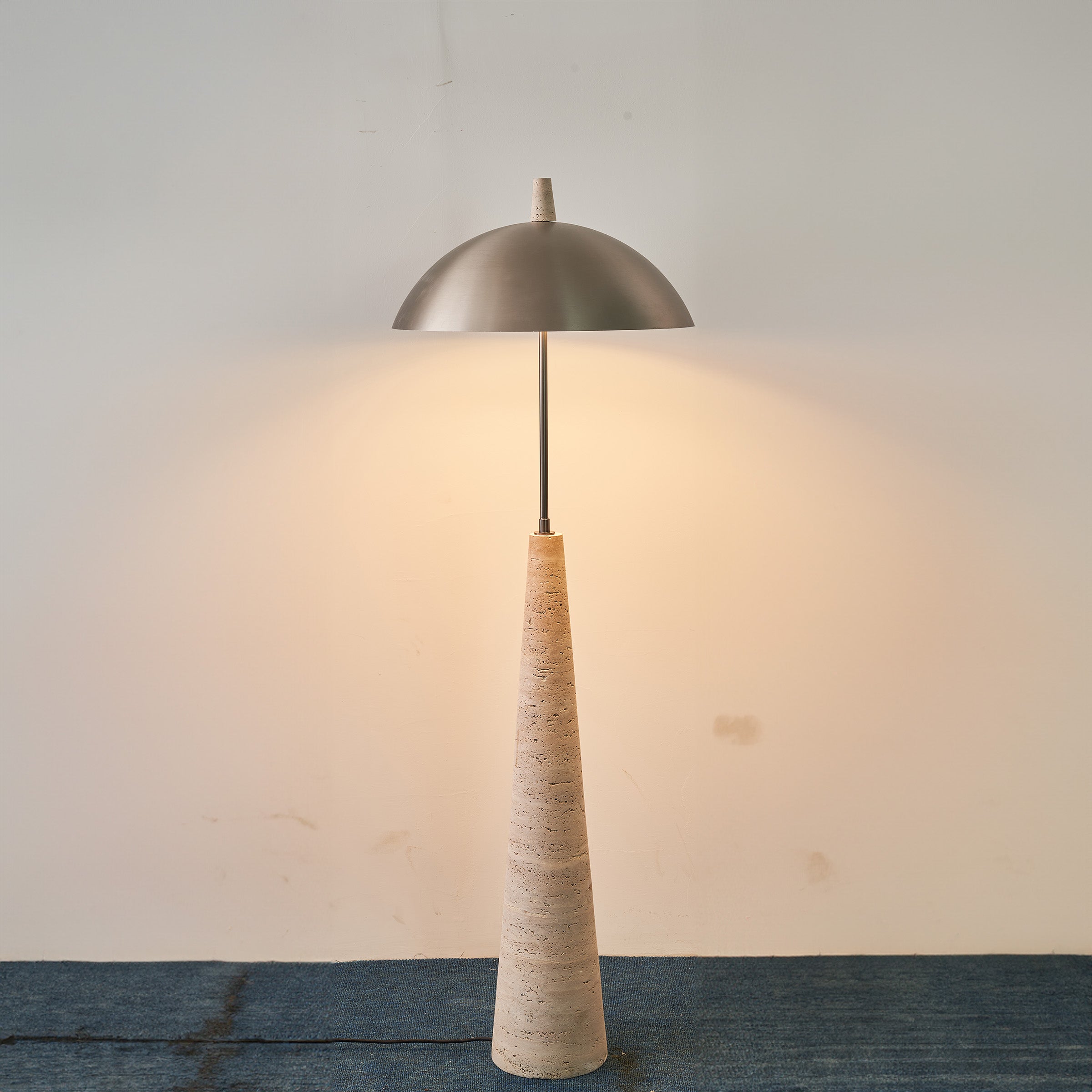 Natural travertine floor lamp by BEACON, model JA-015F, featuring a stylish, textured stone base and a sleek lampshade.