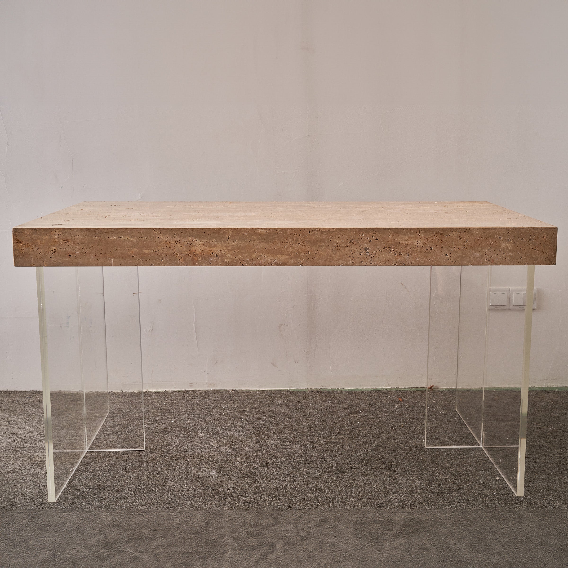 Natural travertine office conference table by BEACON, sleek and modern office desk with smooth stone surface.