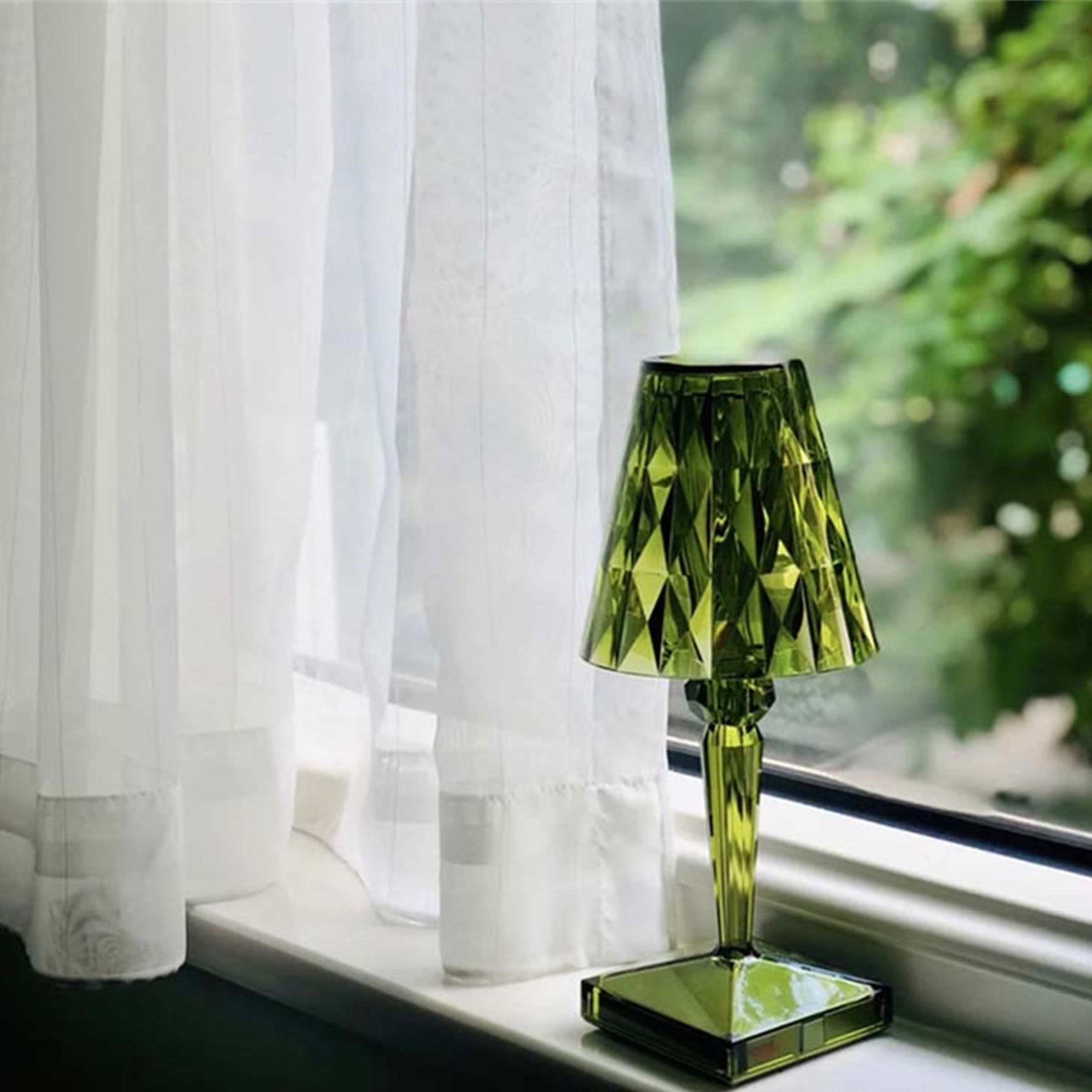 Green BEACON night light table lamp on a desk, with a sleek modern design and soft ambient lighting for cozy spaces.