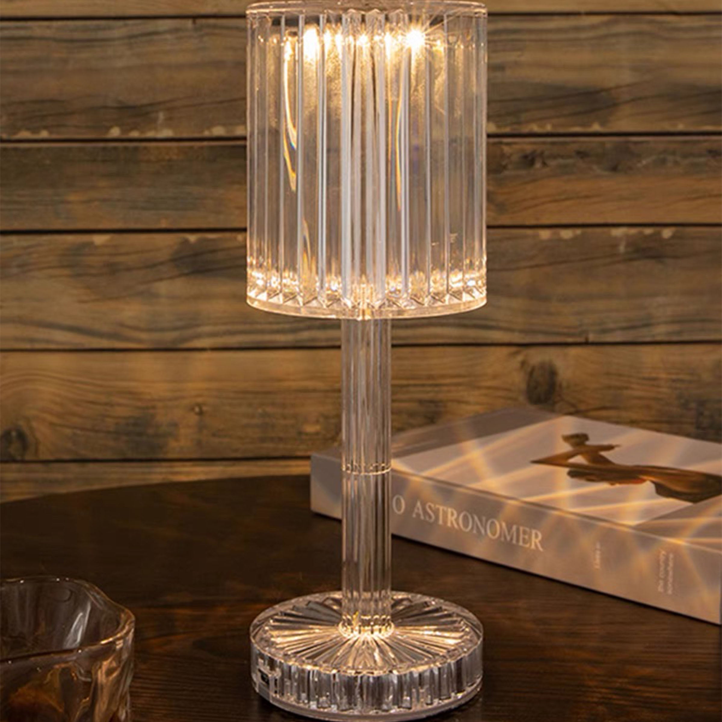 BEACON transparent night light table lamp on a desk, modern design with soft glow for ambient lighting.