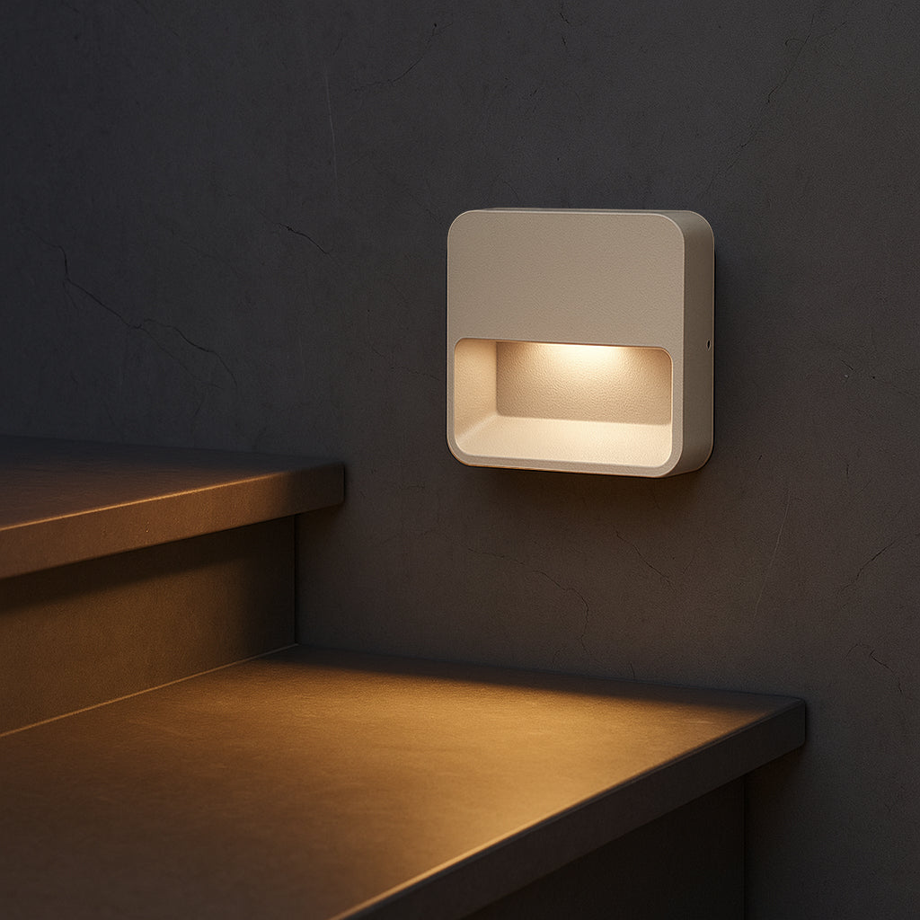 Beacon NightEdge wall lamp in Sandy Taupe with a sleek, modern design, mounted on a wall for ambient lighting.