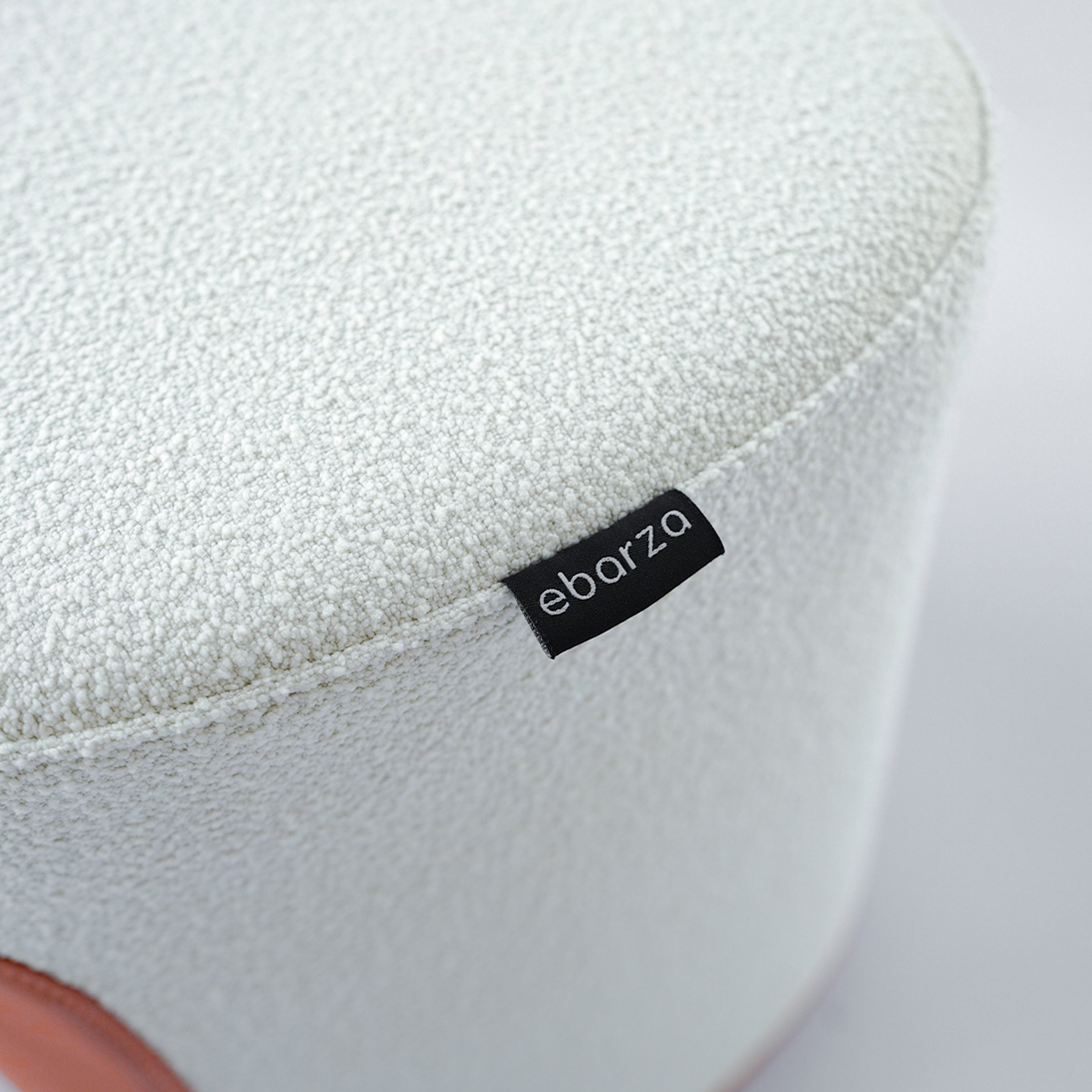 BEACON Nomad Fabric/PU Pouf in caramel color, versatile seating and décor piece, with a soft, textured surface.