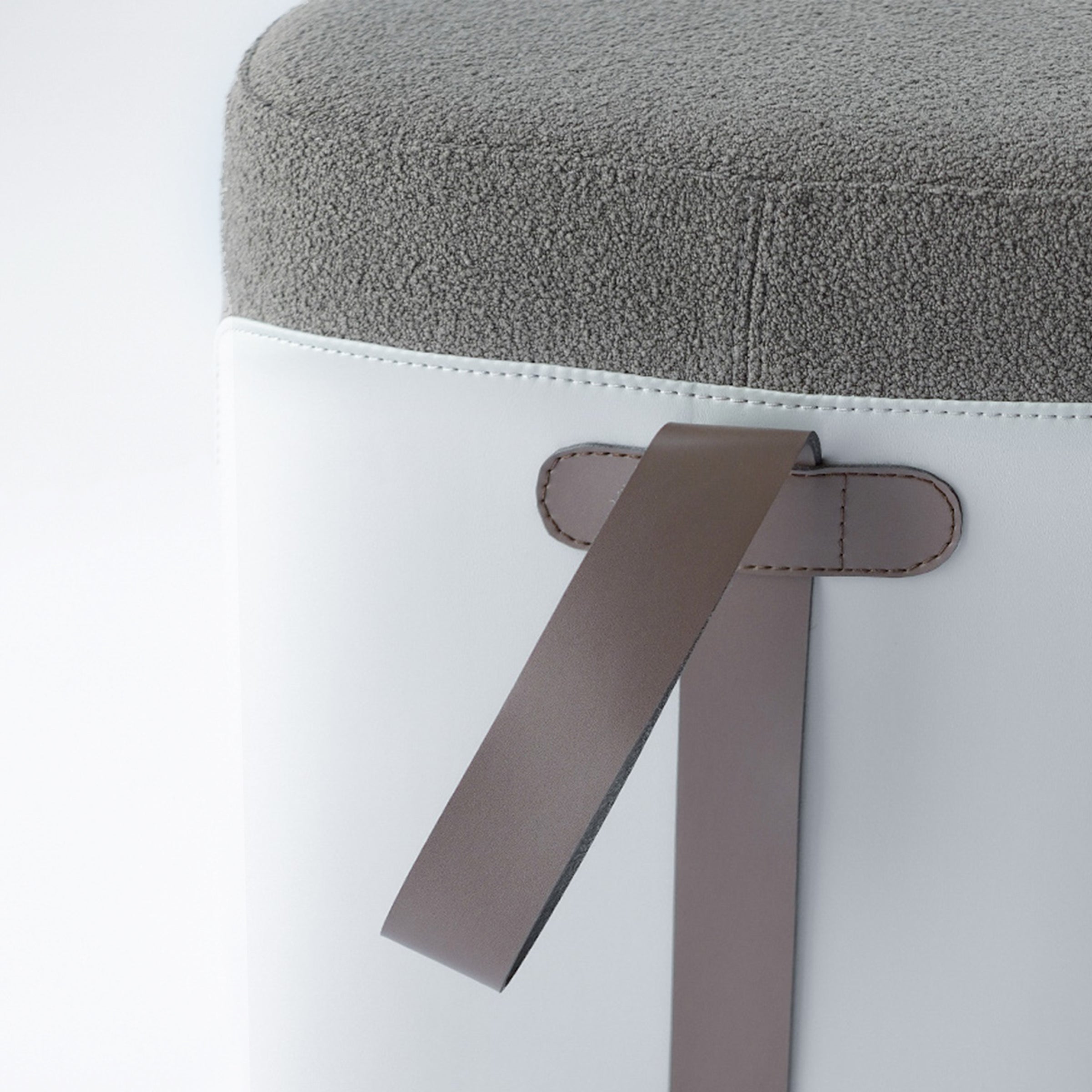Grey Nomad fabric and PU pouf by BEACON, showing a soft, square-shaped seating cushion with textured fabric and modern design.