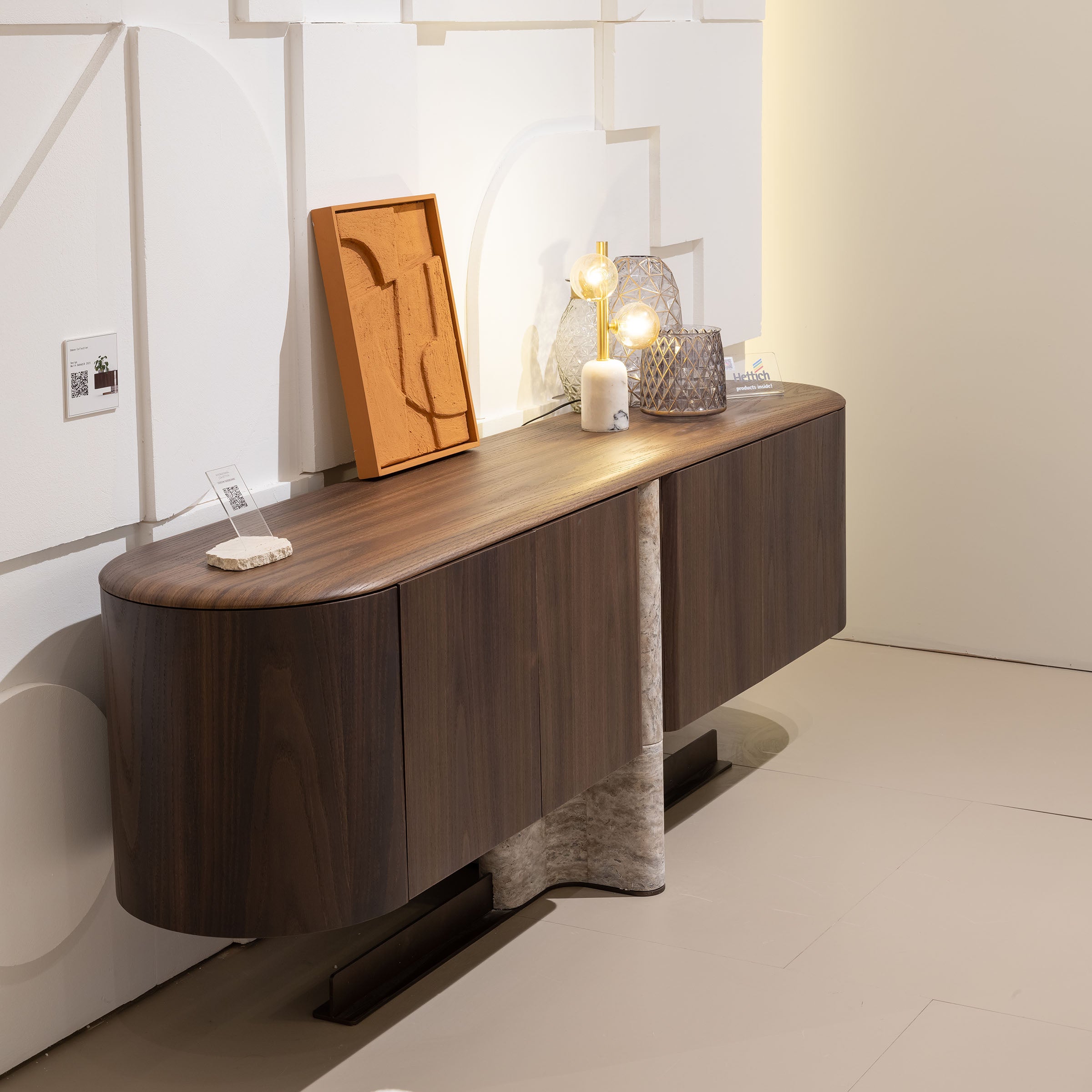 Wooden ODEON CONSOLE sideboard by HOMAGE KOLTUK, with sleek design and storage compartments, shown in a modern living room setting.