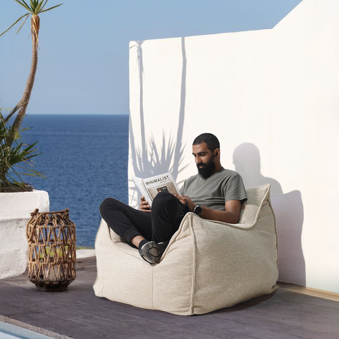 Olefin lounge chair single seater by BEACON, stylish lounge chair with modern design, beige upholstery, and wooden legs.