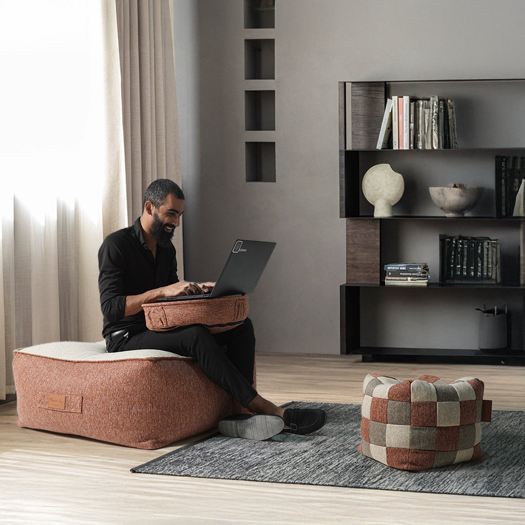Multi-color Olefin pouf from BEACON featuring a soft, cushioned surface perfect for casual seating and decorative accents.