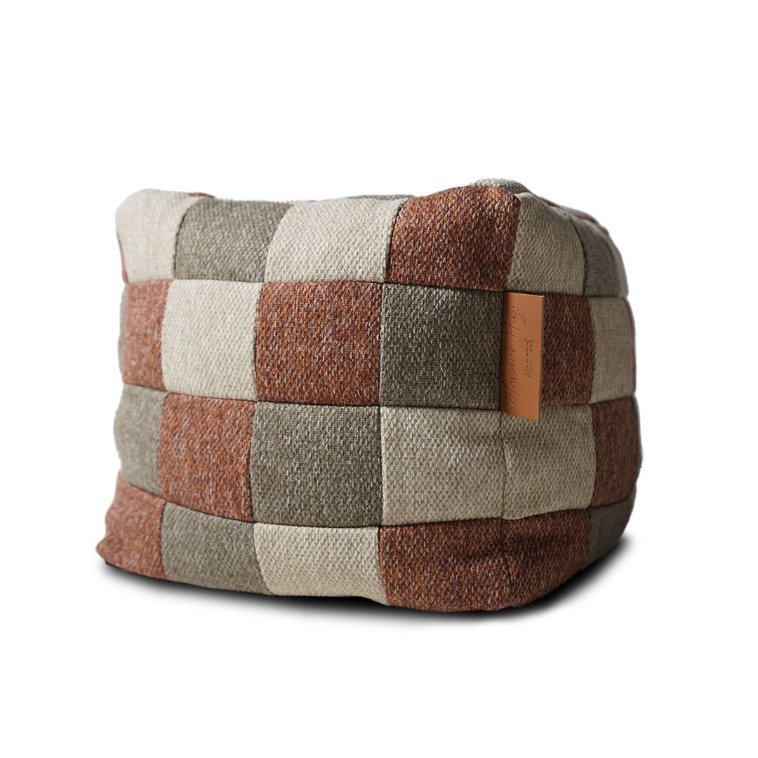 Multi-color Olefin Pouf by BEACON, a versatile fabric ottoman with vibrant patterns, perfect for casual seating.