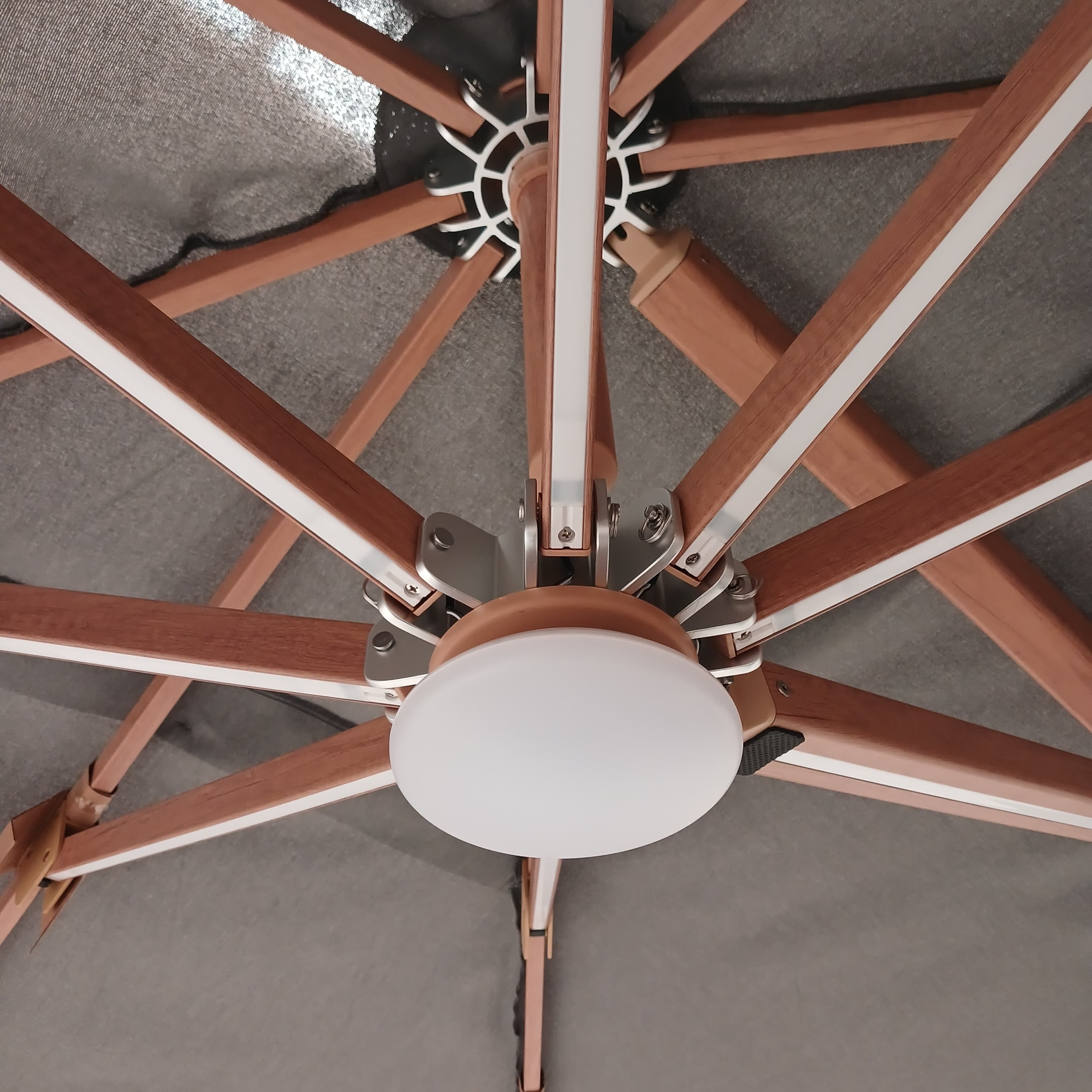 BEACON Opal cantilever outdoor umbrella with matching base, featuring a stylish design and sturdy construction for outdoor shading