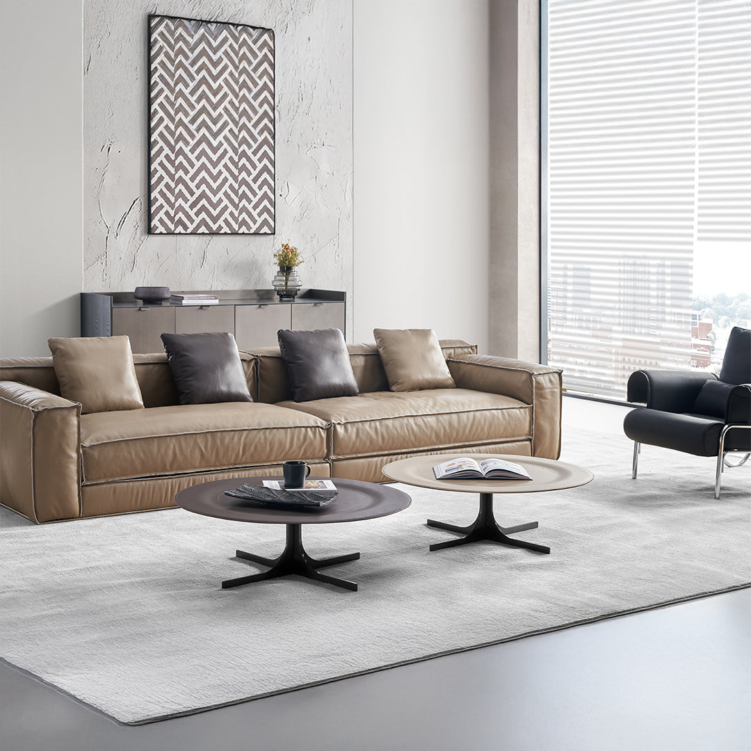 BEACON Orbit Lux brown saddle leather coffee table with sleek design and sturdy legs, perfect for modern living rooms.