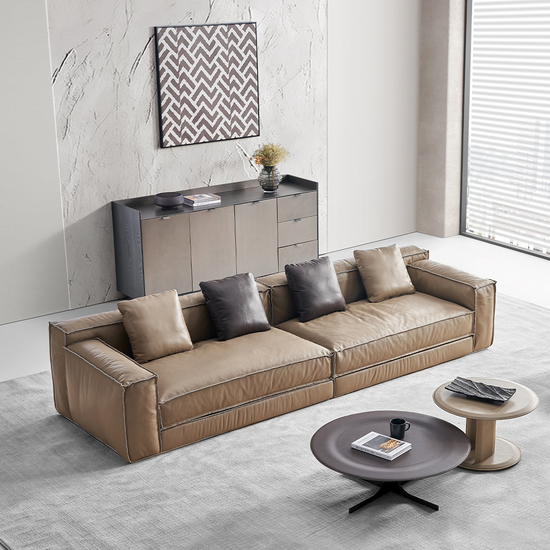 BEACON Orbit Lux brown saddle leather coffee table with sleek design and sturdy legs, perfect for modern living rooms.
