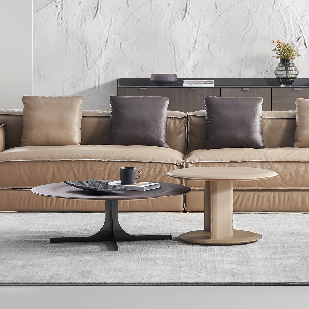 BEACON Orbit Lux Brown Saddle Leather Coffee Table with sleek design and sturdy legs, perfect for modern living rooms.