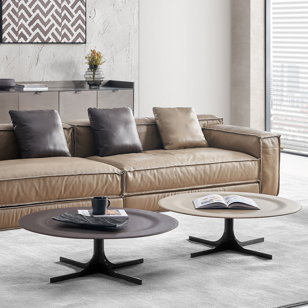 Orbit Lux Brown Saddle Leather Coffee Table by BEACON features a sleek saddle leather surface and modern design.