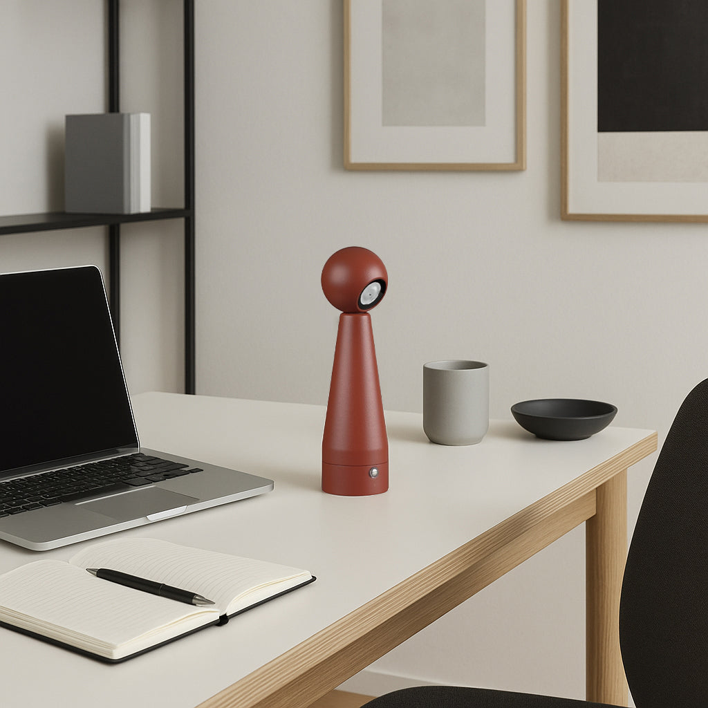 Beacon orbital focus table lamp in sandy red with a modern, adjustable desk lamp design for focused lighting.