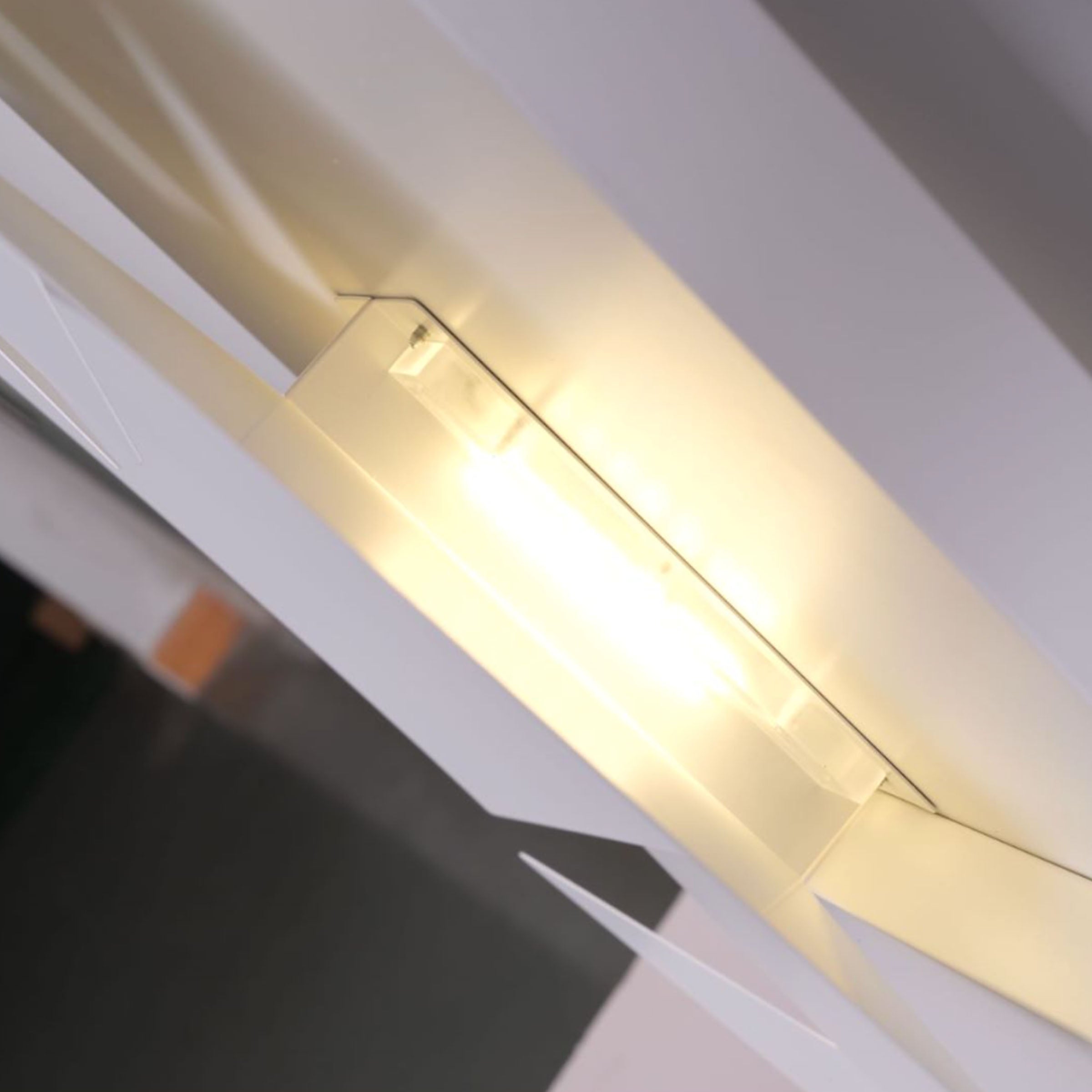 BEACON Origami Wall Lamp CY-BD-1059 with geometric folded paper design, mounted on a wall for modern lighting decor.