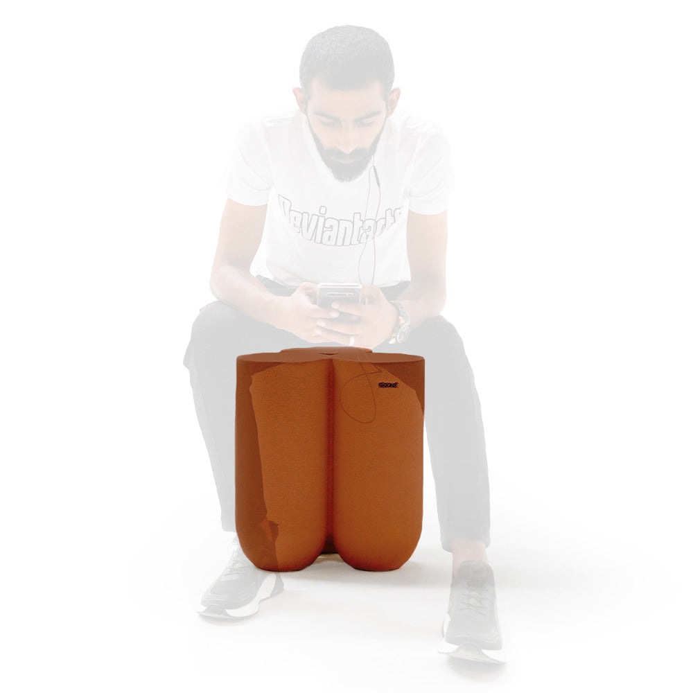 BEACON clay pouf for outdoor and indoor seating, round, textured surface, versatile and stylish home decor accessory.