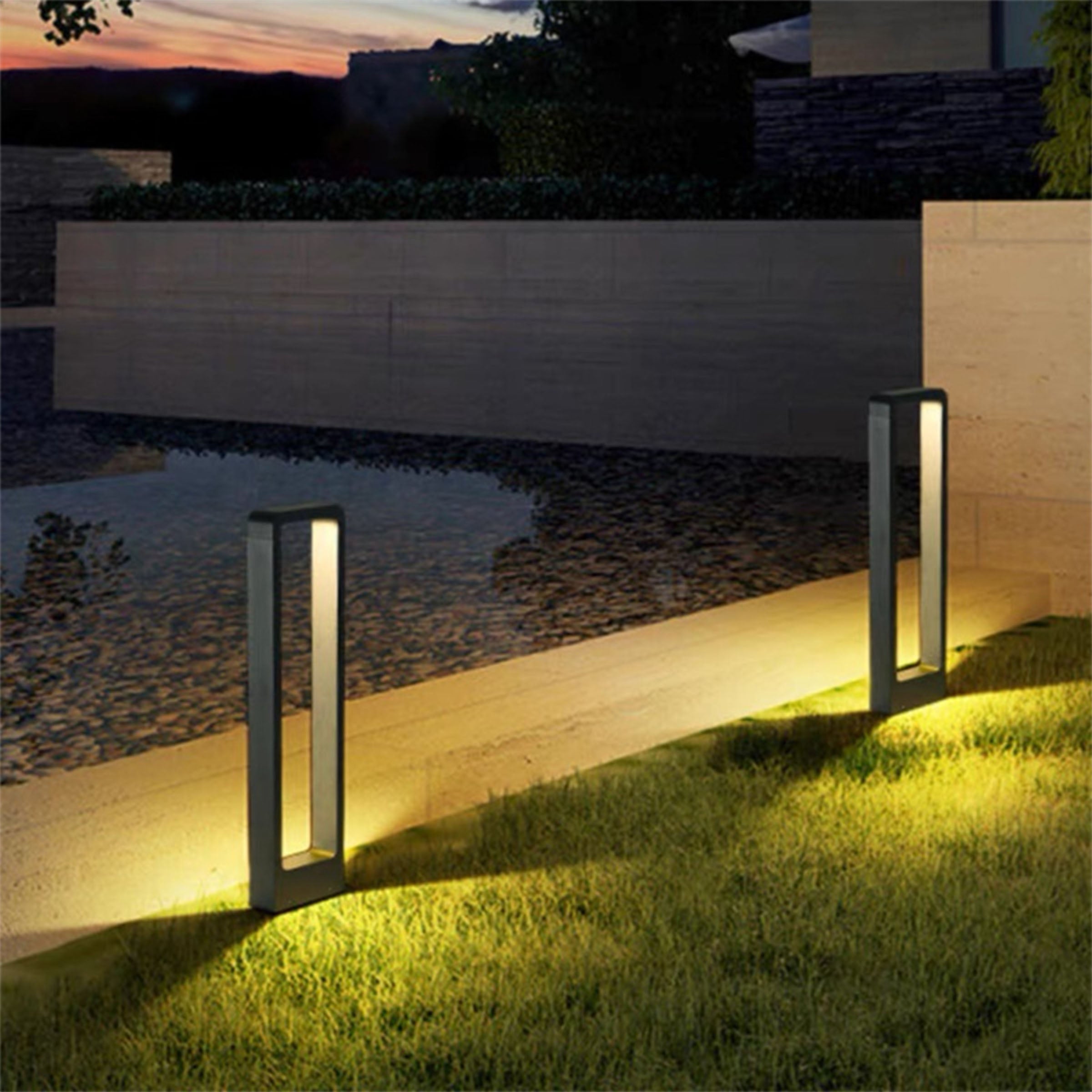 Outdoor BEACON HTD-K-2911 lawn light illuminating a garden with a modern outdoor lighting design.