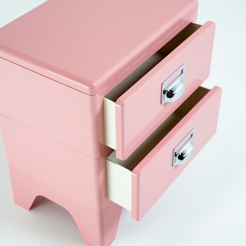 Pink ABS bedside table by RUDI with a sleek, modern design, featuring a compact side table for bedroom or living space.
