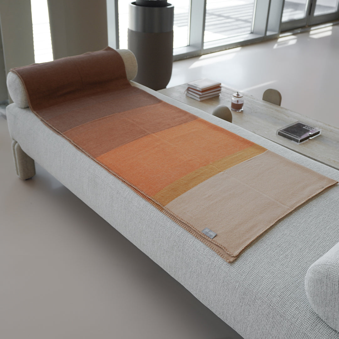 Soft BEACON PlushHaven throw blanket in 260GSM, cozy plush fabric, draped over a sofa for warmth and comfort.