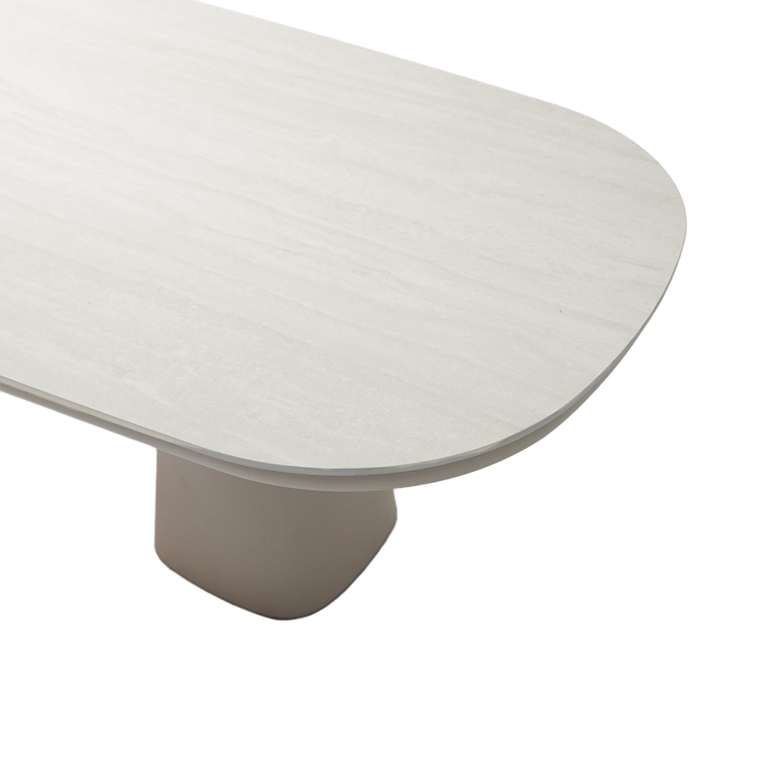 Outdoor dining table with ceramic top from BEACON, featuring a sturdy rectangular design and modern aluminum and block construction.