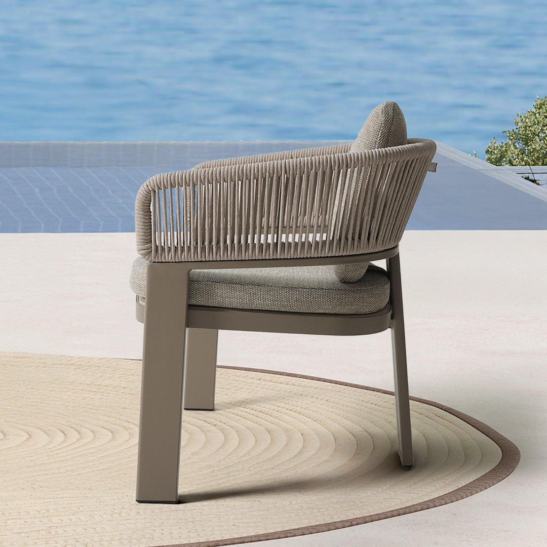 BEACON Cayenne outdoor dining armchair with armrests, weather-resistant design, modern style, and neutral finish.