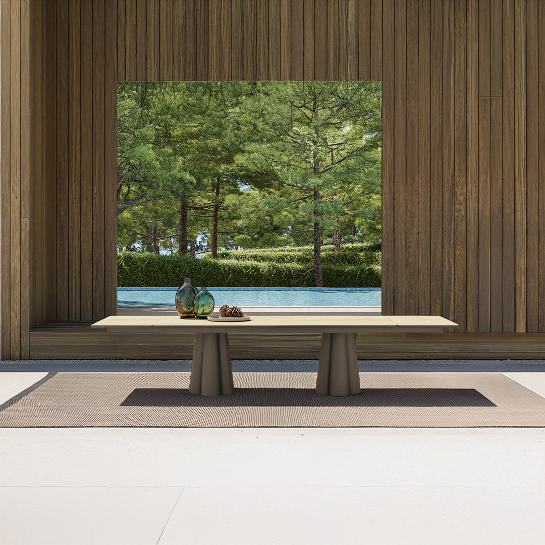 Outdoor extendable dining table by BEACON, Clover model with 2 extensions, weather-resistant wood finish, perfect for outdoor gatherings.