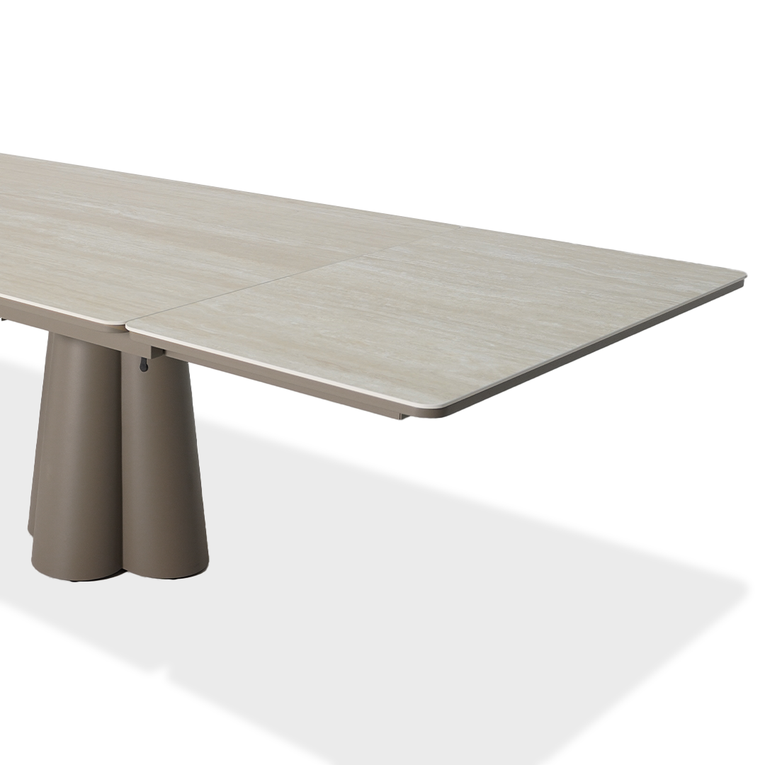 Outdoor extendable dining table by BEACON with 2 extensions, made of durable materials, designed for outdoor patio use.
