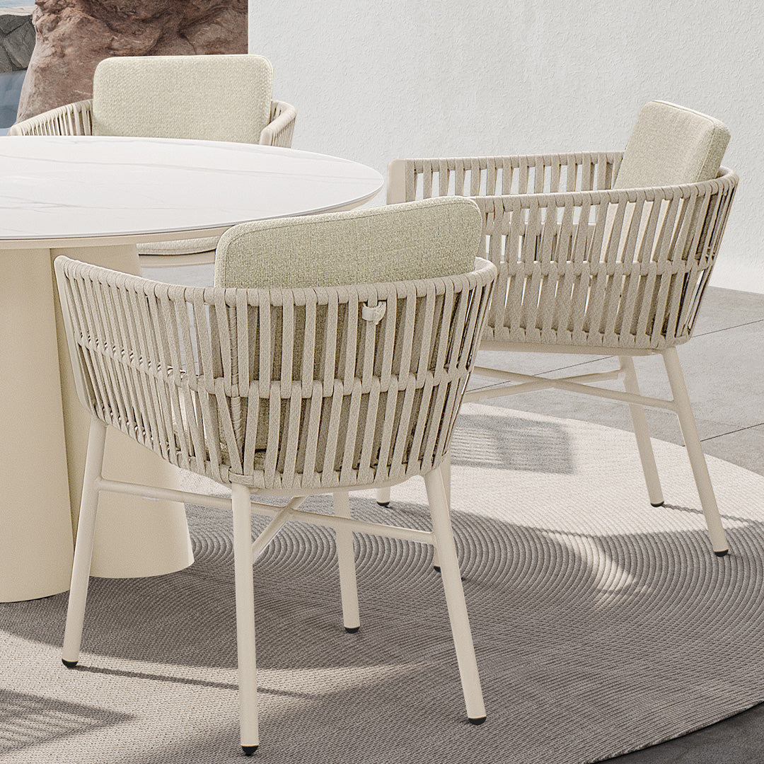 Marrakech outdoor dining armchair by BEACON, with woven design and armrests, perfect for patio or garden seating.