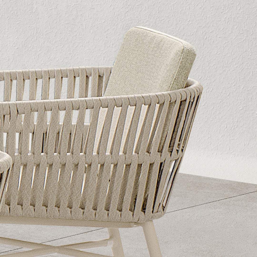 Marrakech outdoor dining armchair by BEACON, featuring woven design and armrests, perfect for patio or garden seating.