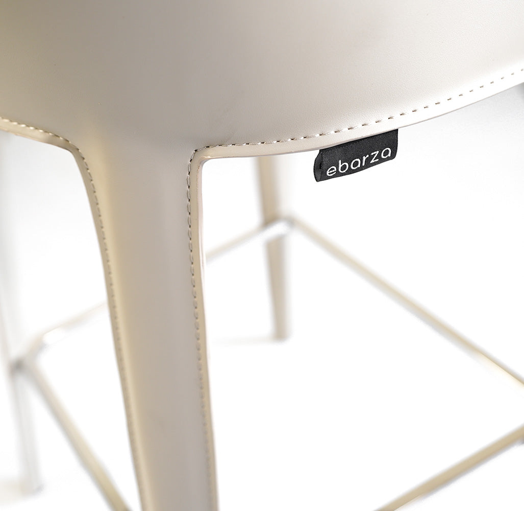 Mycroft Saddle Leather Bar Stool by BEACON featuring a stylish saddle leather seat and sturdy metal frame, perfect for modern bar areas.
