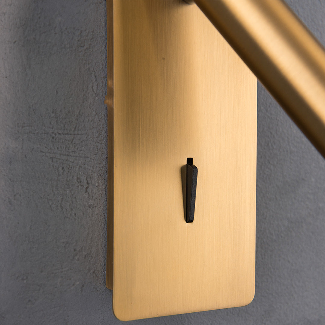 Gemini Hotel Style Wall Reading Lamp by BEACON, mounted on headboard with adjustable brightness, in a classic bronze finish.