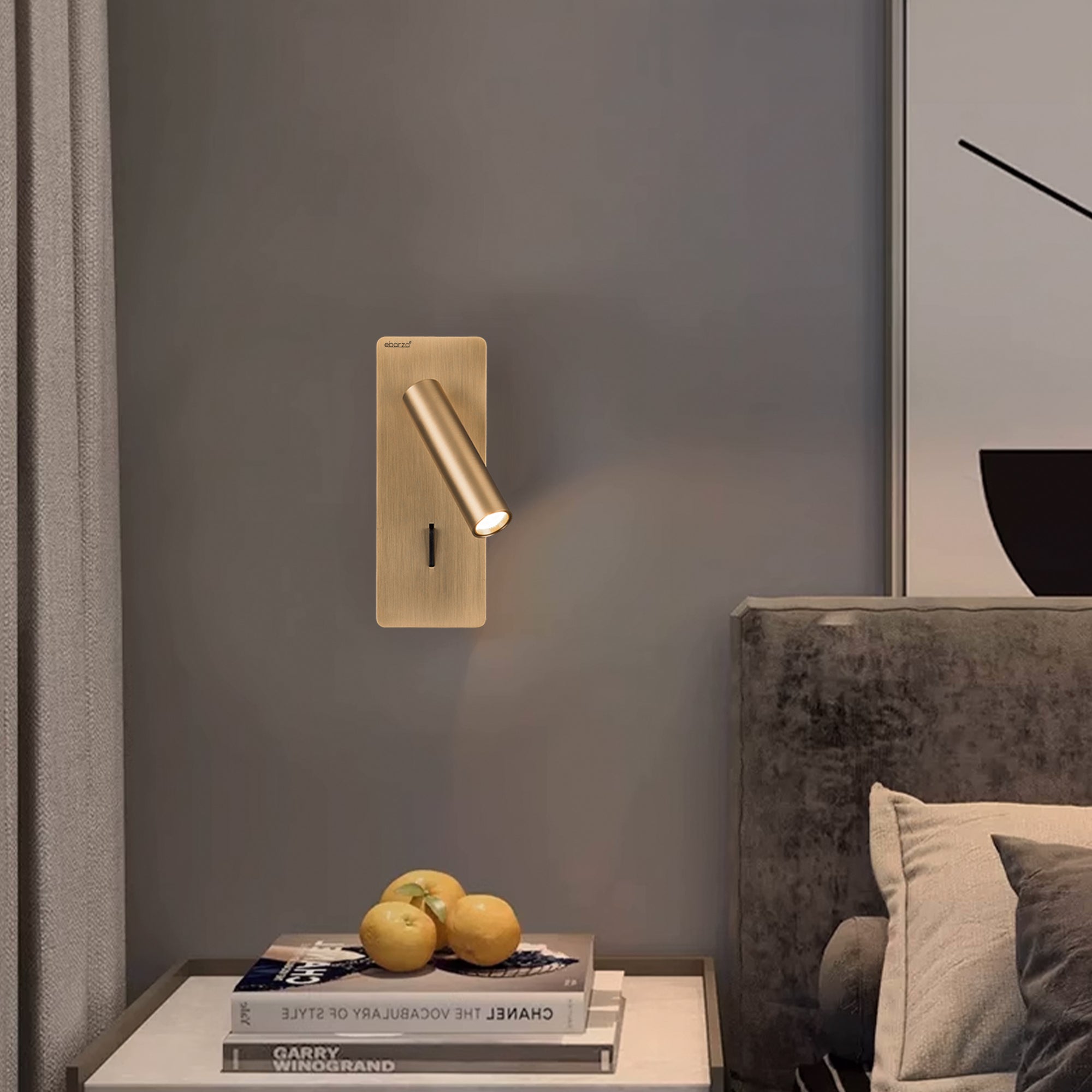 BEACON Gemini hotel style wall reading lamp mounted on headboard, featuring a sleek design and adjustable arm in bronze finish.