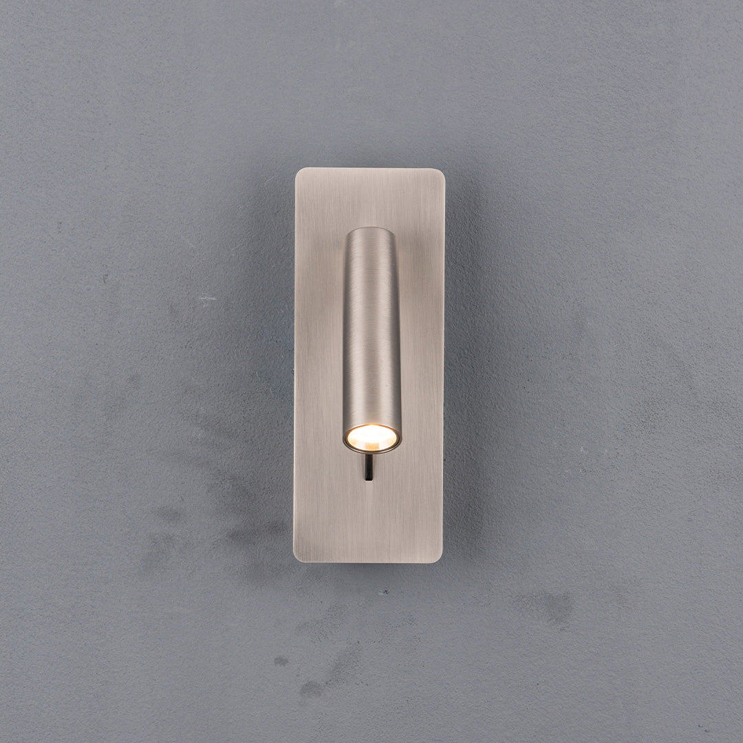 BEACON Gemini hotel-style wall reading lamp with sleek design, mounted on a headboard, ideal for bedroom or hotel decor.