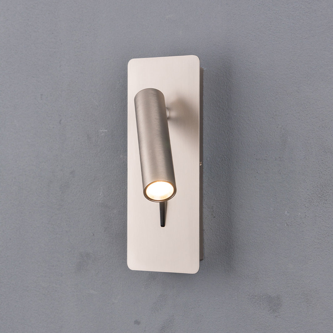 BEACON Gemini hotel-style wall reading lamp mounted on headboard, sleek design, perfect for bedside lighting.