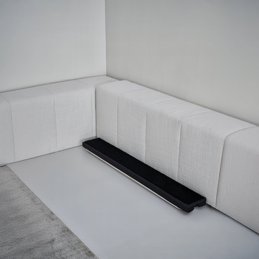 Puzzle headboard and long back sofa unit from BEACON bedstead collection, featuring a modern, modular design in a neutral finish.