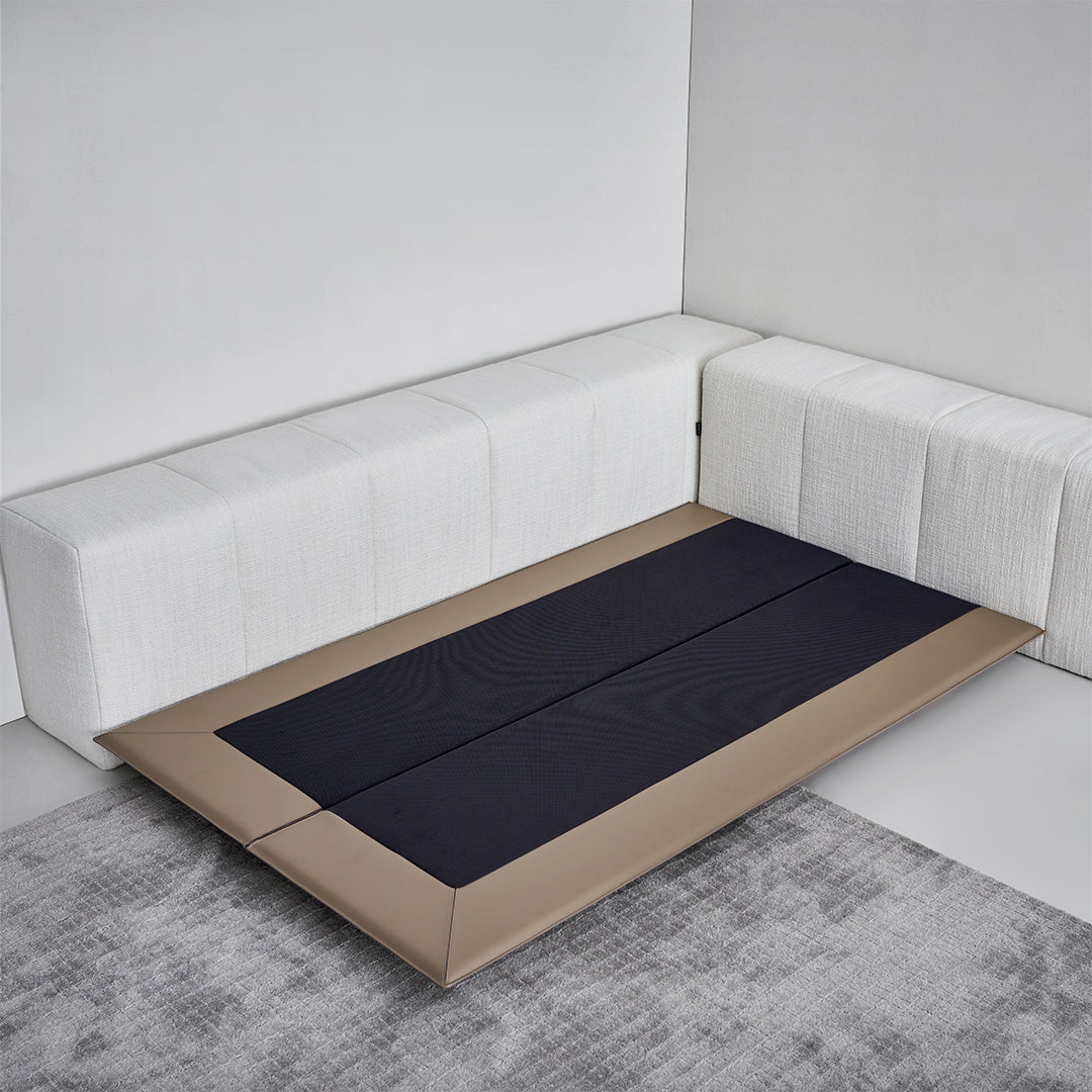Puzzle headboard and long back sofa unit by BEACON, modern bedstead with integrated seating in a sleek design.