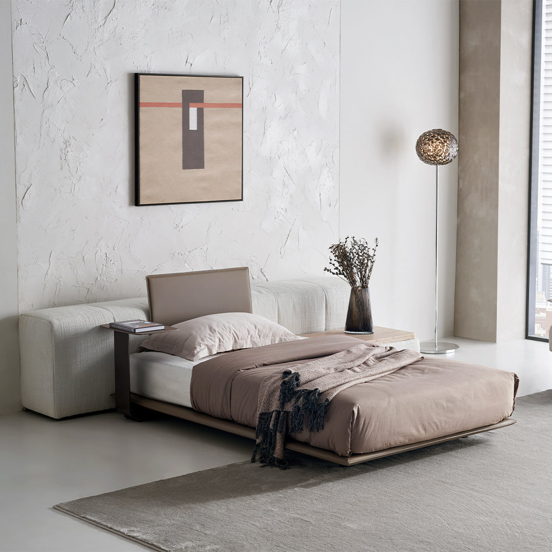 Puzzle headboard and long back sofa unit from BEACON bedstead collection, featuring a modern design with plush cushioning.