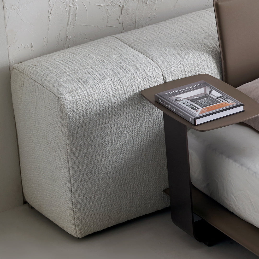 Puzzle headboard and long back sofa unit from BEACON bedstead set, featuring a modern design with cushioned seating and wood finish.