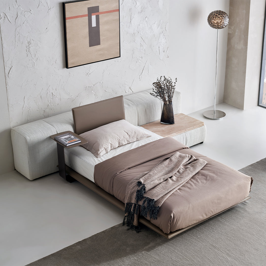 BEACON puzzle headboard and long back sofa unit bedstead in a modern design, featuring a sleek, elongated backrest and sturdy frame.