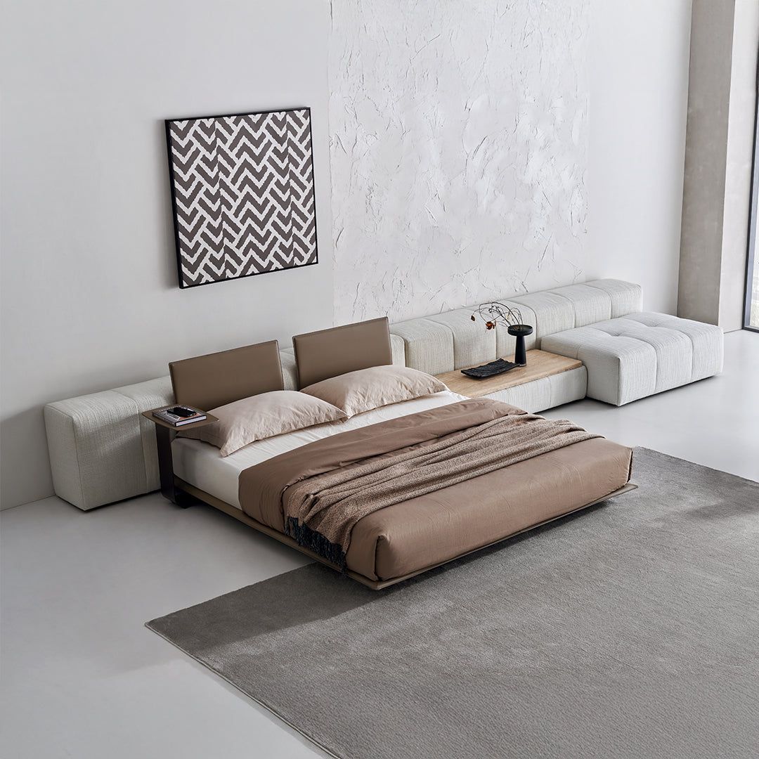 BEACON Puzzle Suspended Bed Base with 2 backrests, modern bedstead with unique design, shown in a well-lit bedroom setting.