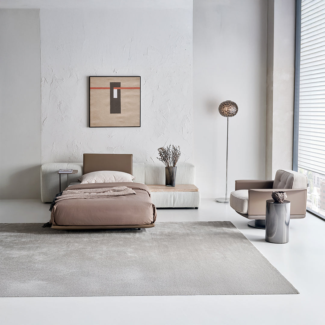 Puzzle suspended single bed base with one backrest by BEACON, featuring a modern design and sturdy construction.