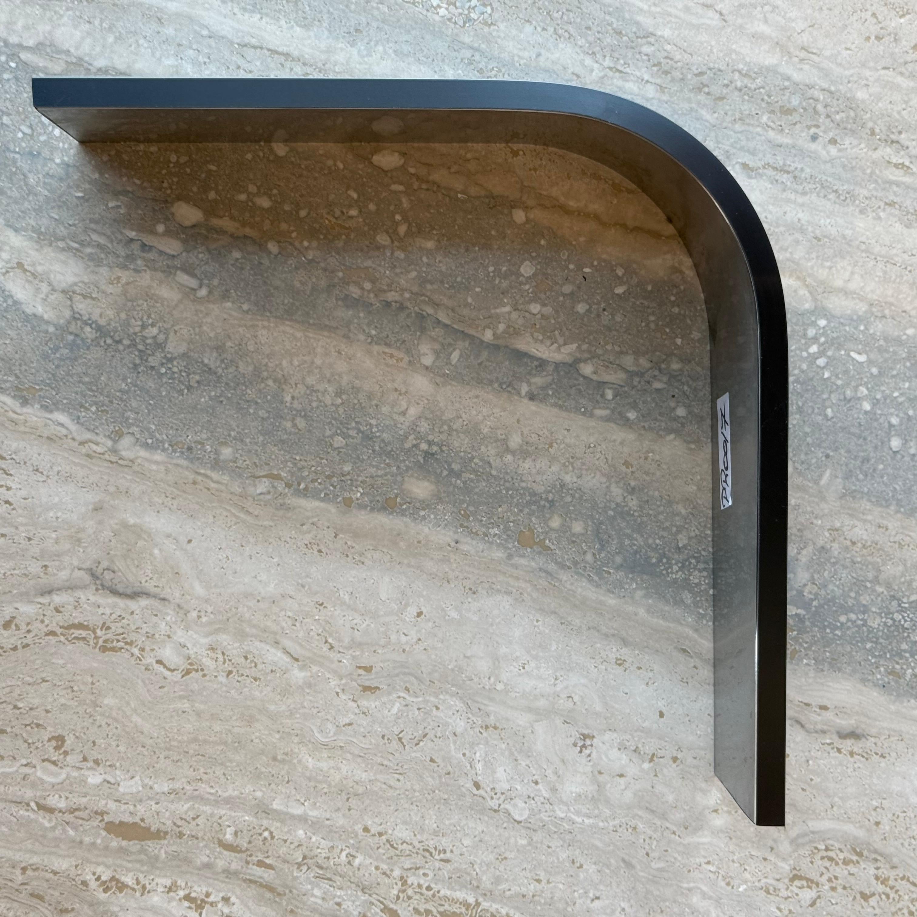 Black R100 10cm external corner skirting accessory by BEACON for wall panels and profiles, shown in close-up detail.