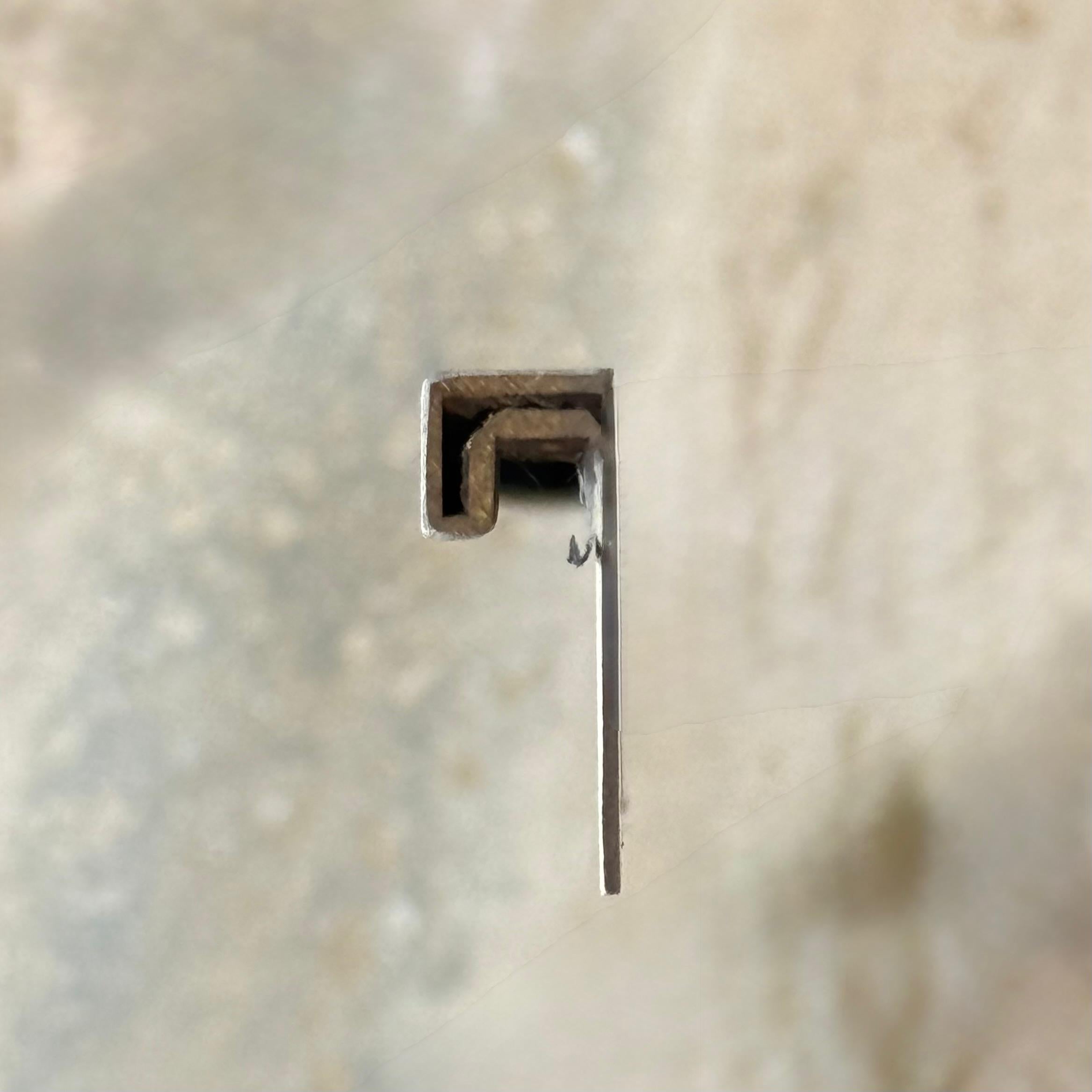 Black R100 2.5cm external corner accessory for wall panels and profiles by BEACON, shown in close-up detail.